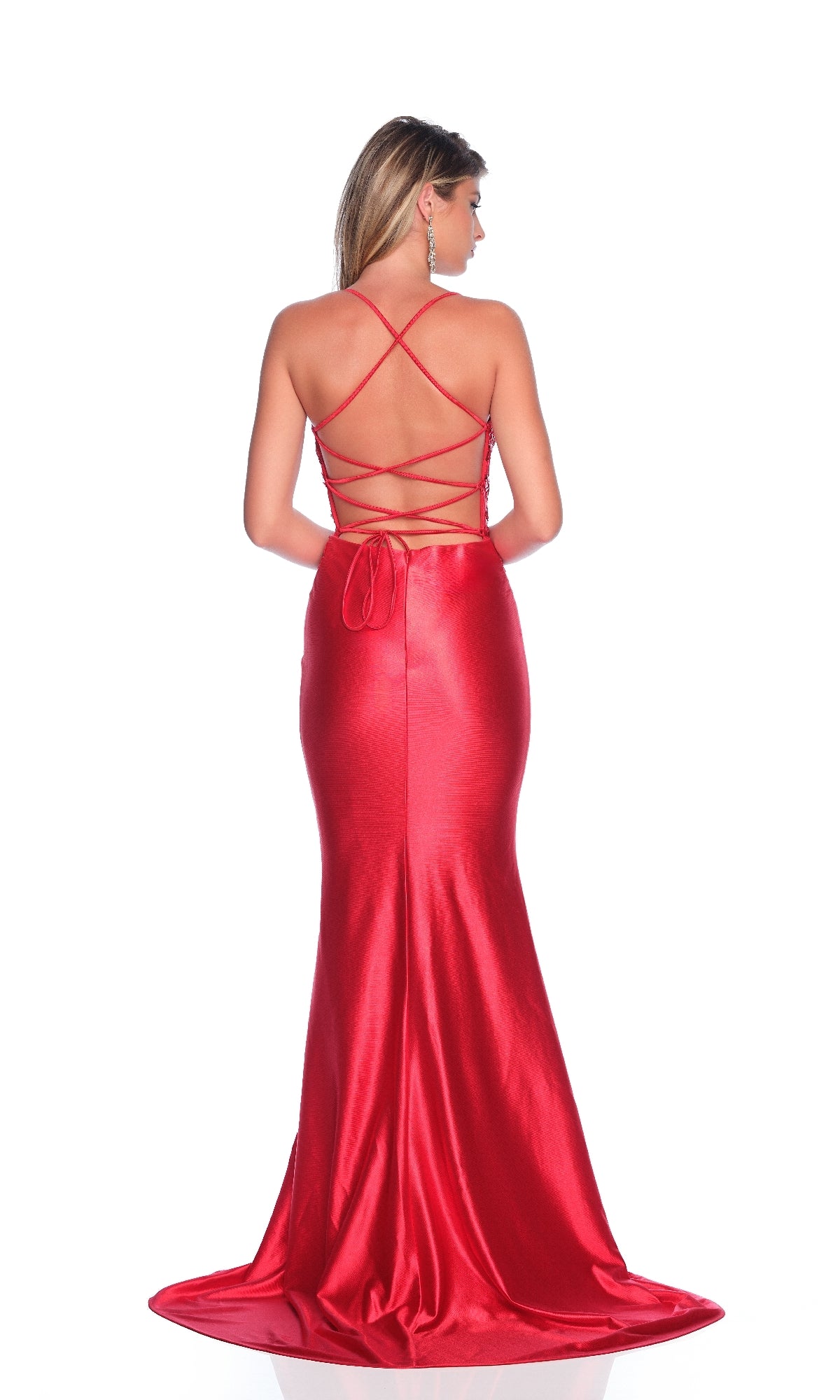 A woman wears the Long Red Prom Dress: Dave & Johnny 12242, featuring a fitted silhouette, sequin-embroidered bodice, and crisscross straps on the open back.